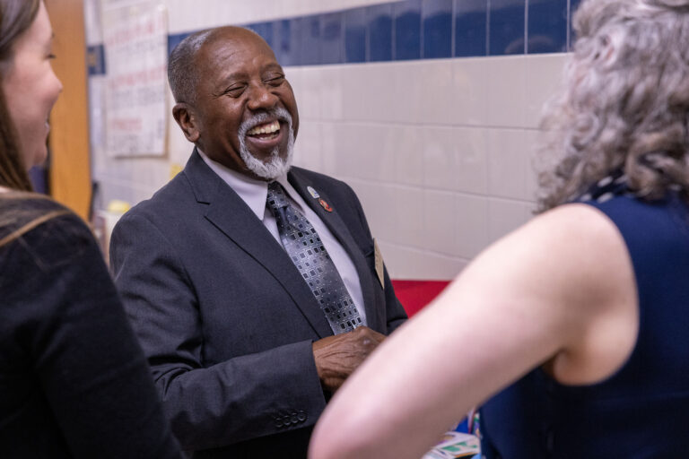 A Melody of Transformation: E2CCB Board Members Honors Teacher Who Changed His Life
