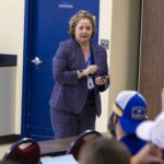 Dr. Melissa Rivers speaking to a group.